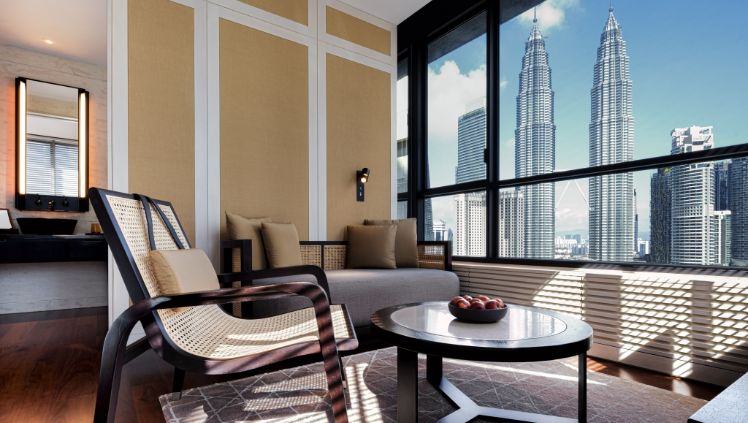 Deluxe Suite lounge with city view at RuMa Hotel & Residences