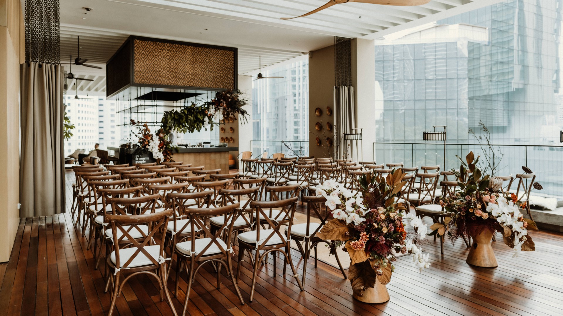Floral indoor wedding ceremony at The RuMa Hotel & Residences