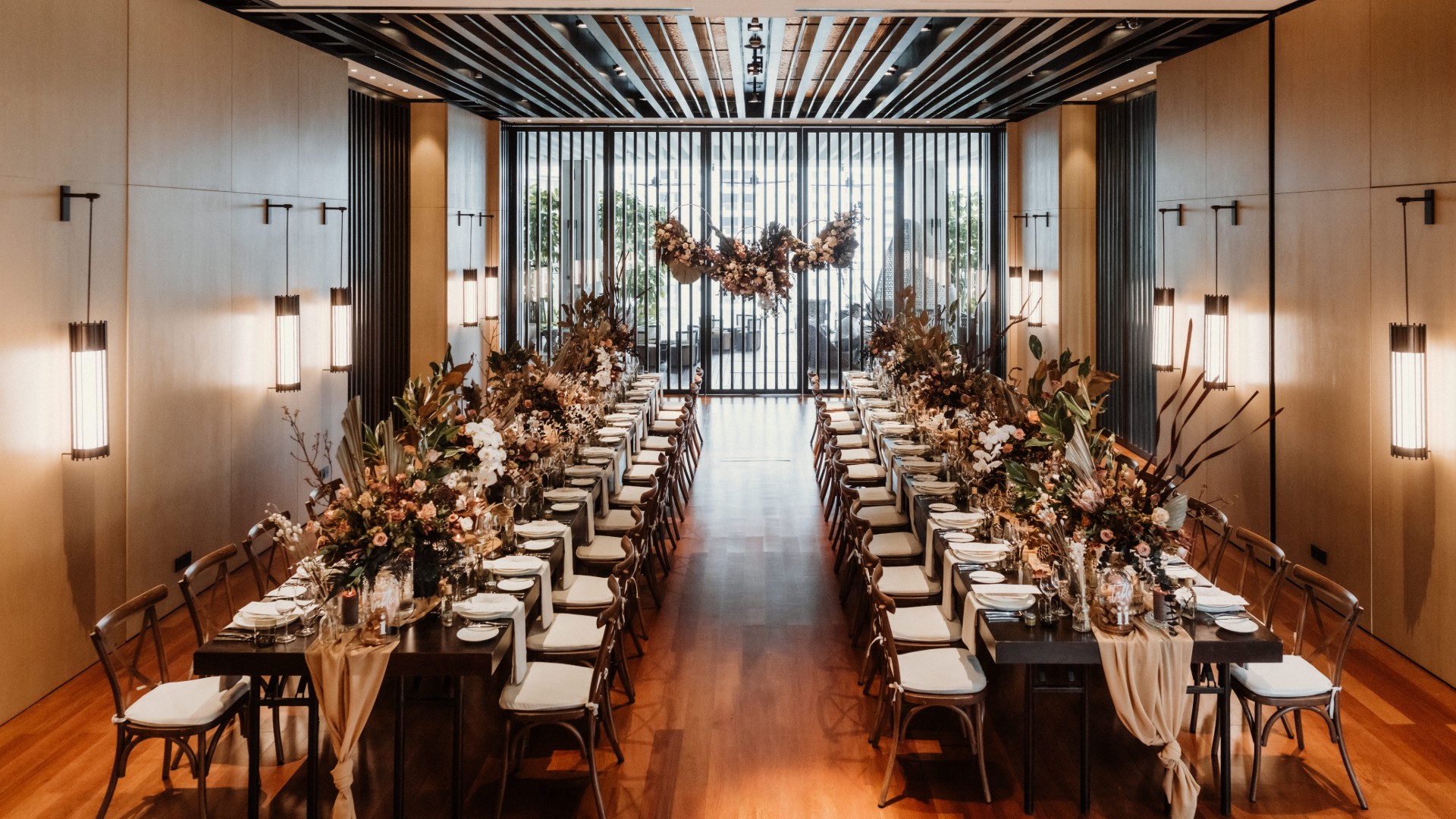 Floral indoor wedding ceremony at The RuMa Hotel & Residences
