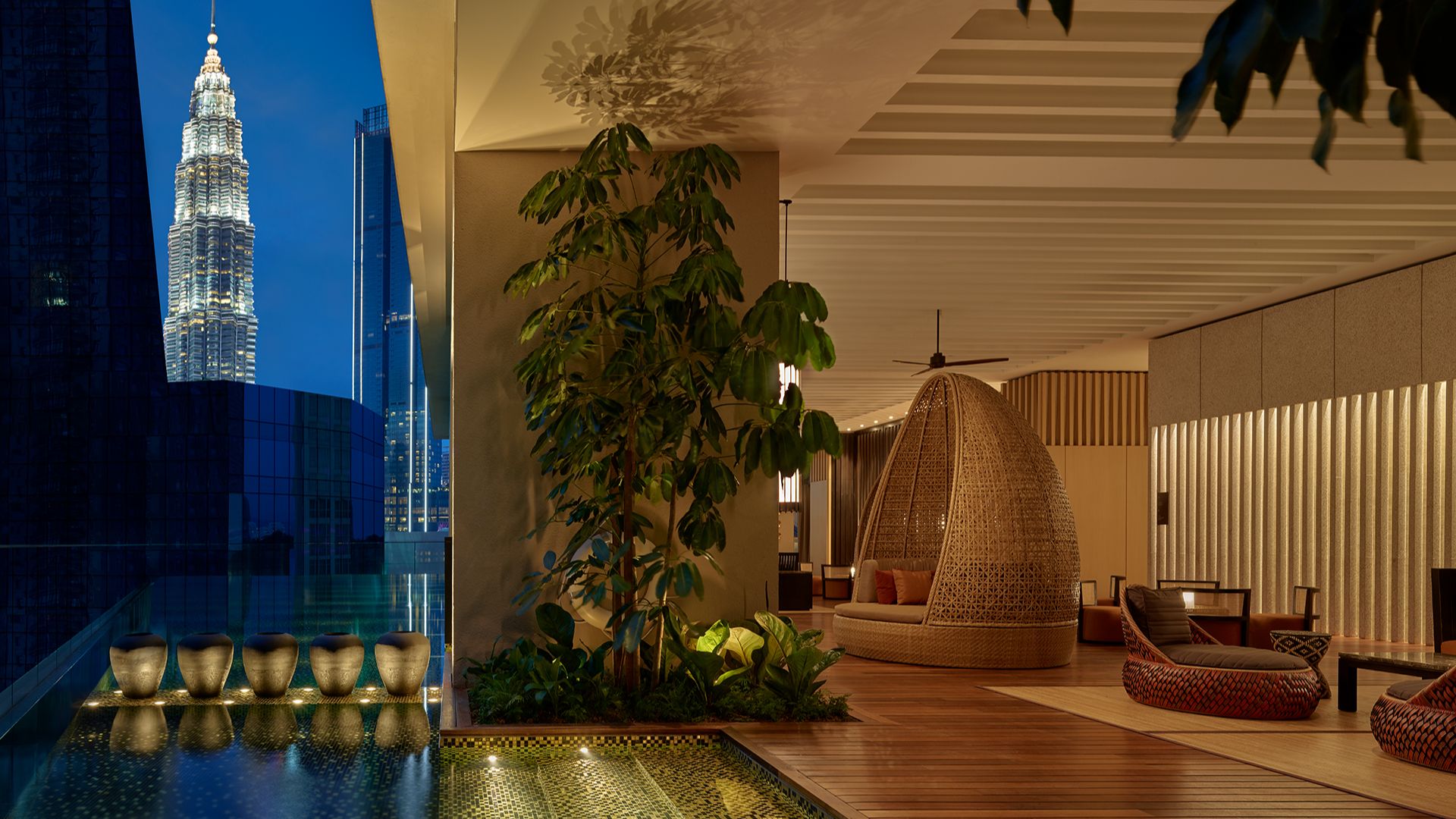 Luxury indoor lounge with city skyline view at The RuMa Hotel and Residences