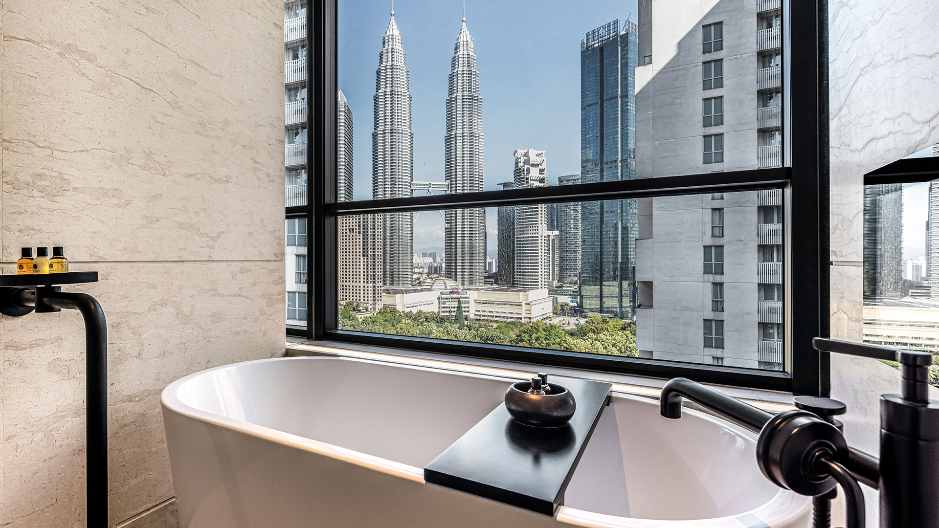 Deluxe Suite lounge with city view at RuMa Hotel & Residences