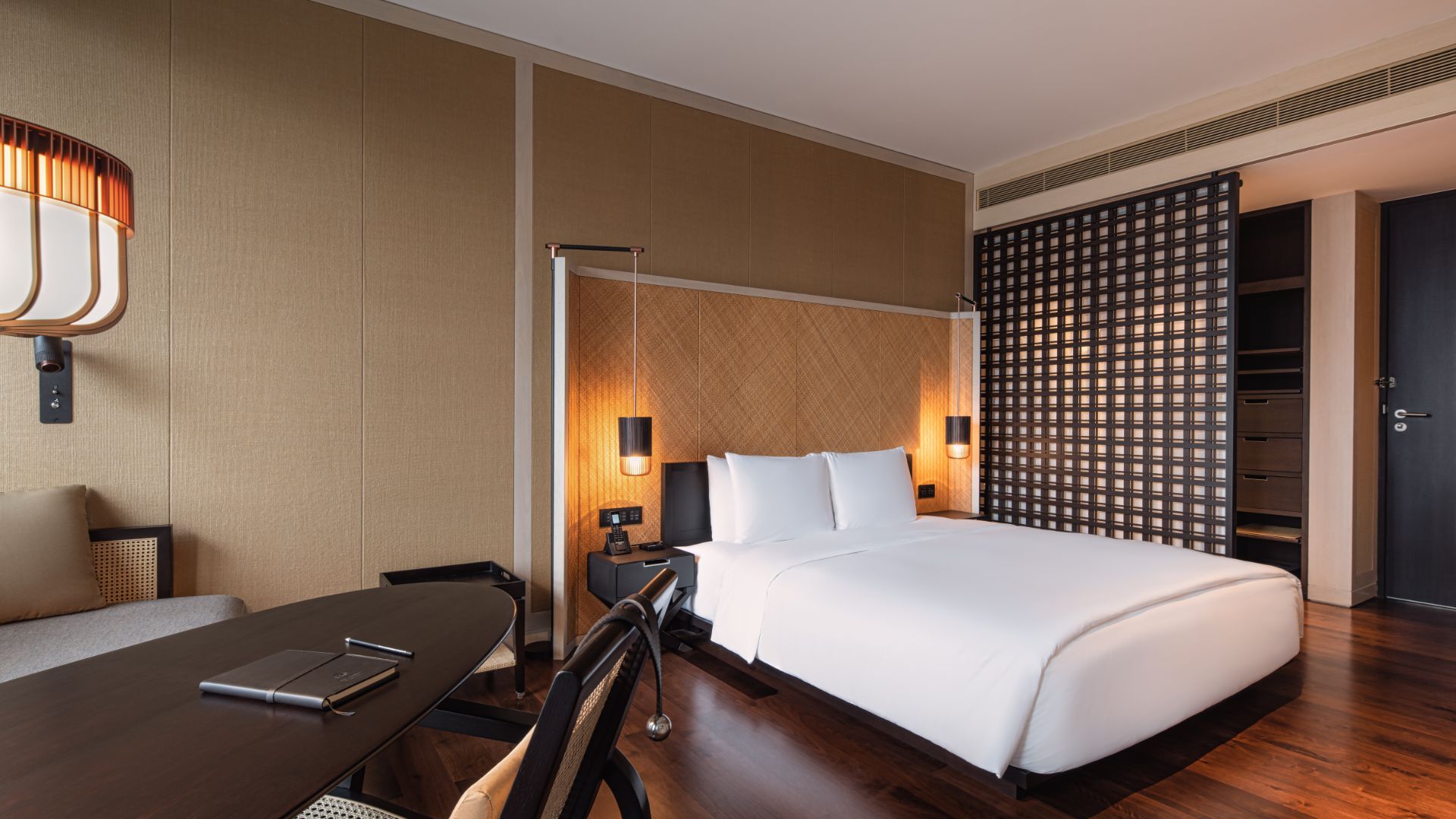 Twin beds in Grand Room at The RuMa Hotel & Residences
