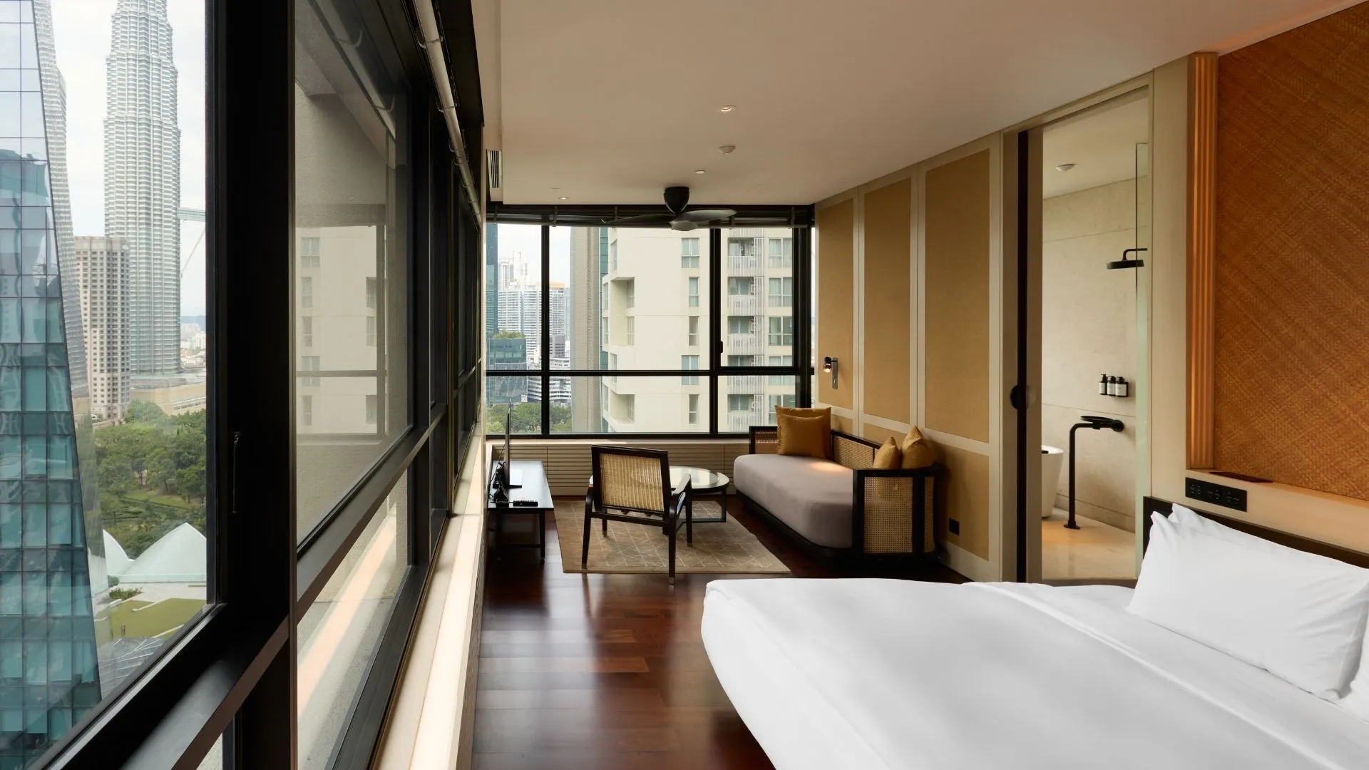 Deluxe Suite with large windows at The RuMa Hotel and Residences